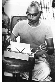 Swami Venkatesananda at his typewriter